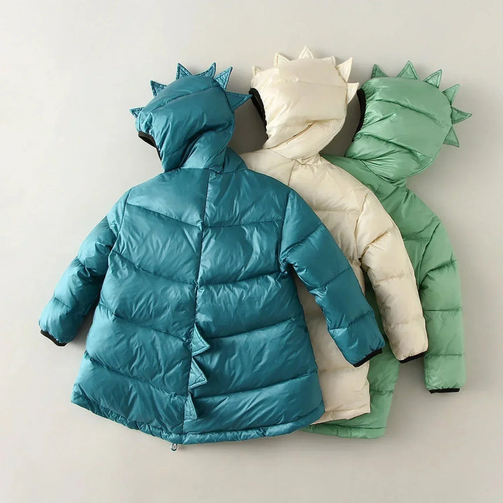 Kids' winter jacket with dino spikes & roaring print. Waterproof & warm for cold weather play. Suitable for boys & girls.