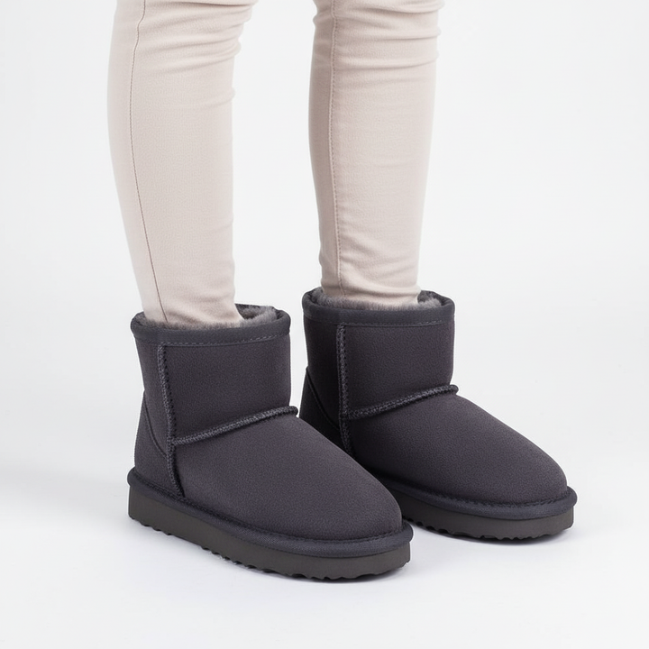 Waterproof warm winter boots for children, detailed view of non-slip sole for traction on ice