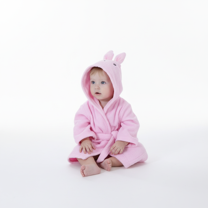 Toddler in a soft yellow animal-themed hooded bathrobe, ideal for absorbent after-bath comfort for kids