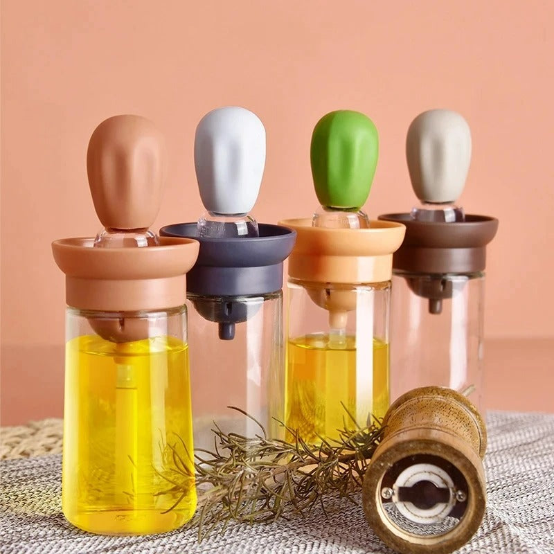 Kitchen silicone oil bottle with integrated brush for cooking, grilling, and baking.
