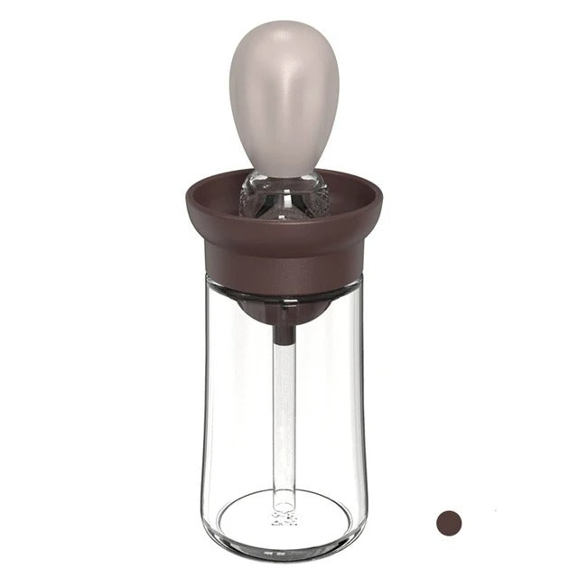 Versatile silicone oil brush bottle, perfect for applying oil or sauce while cooking, grilling, or baking.