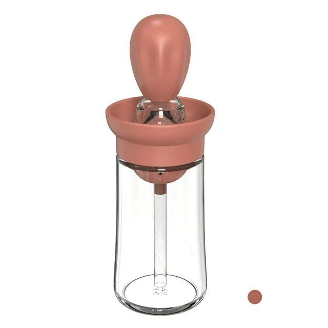Durable food-grade silicone oil bottle with integrated basting brush for healthy, precise cooking.
