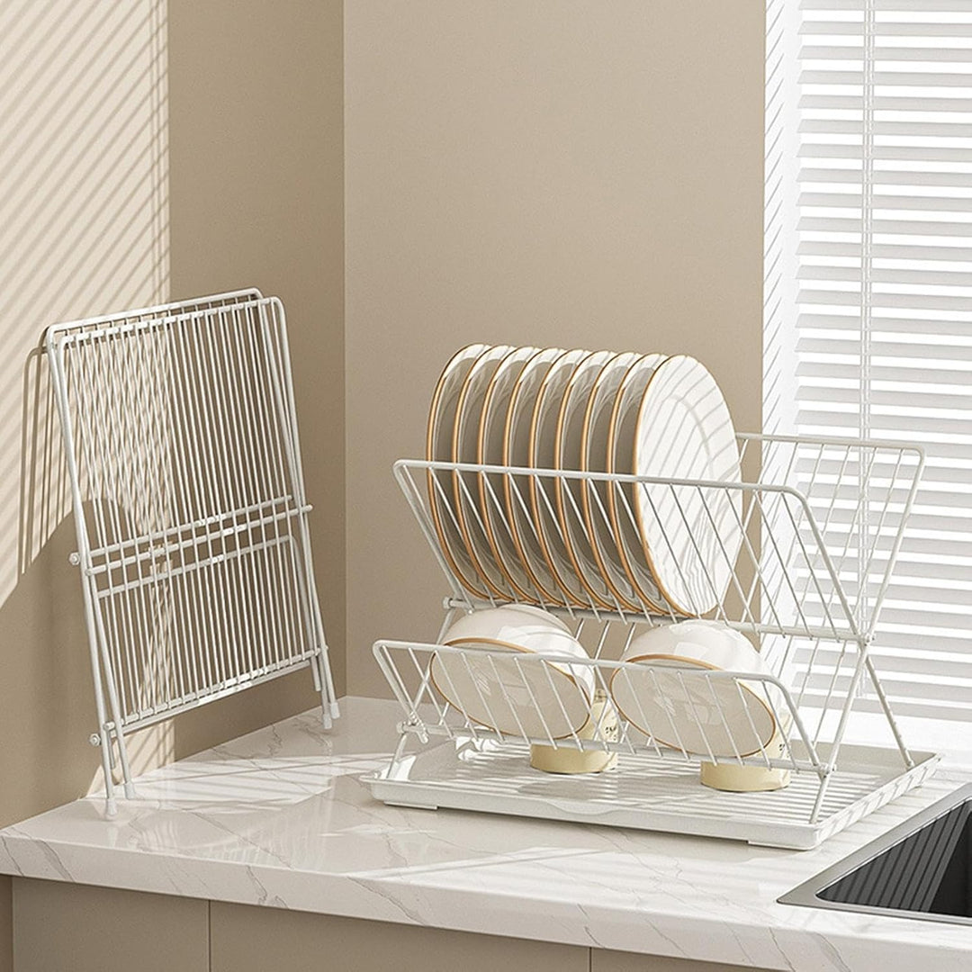 Stainless steel 2-tier dish drying rack with black foldable frame, includes removable drain tray for kitchen.