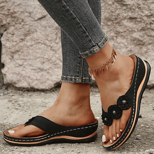 Stylish ladies' wedge sandals, floral detail, providing orthopedic arch support & comfort.