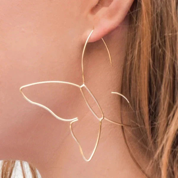 Large elegant gold butterfly dangle earrings for women, a luxurious statement jewelry piece.