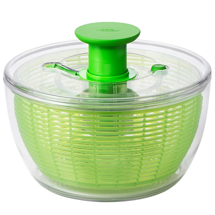 Large green salad spinner with clear bowl, ideal for drying fresh produce like lettuce and vegetables.