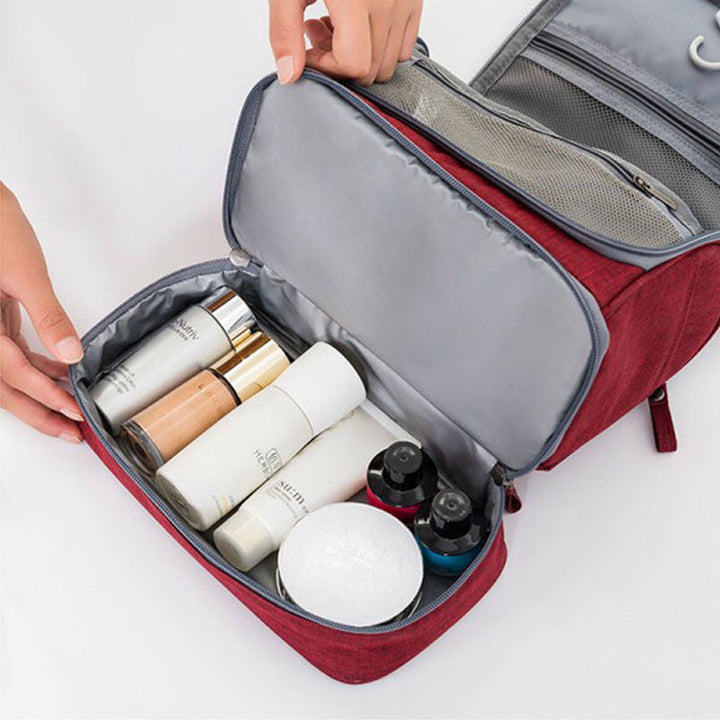 Organized travel accessory, large wash bag with toiletries neatly stored in its compartments