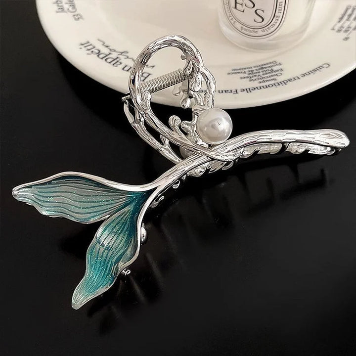 Large mermaid tail hair clip for women, adorned with sparkling details & pearls. Unique oceanic fashion accessory.