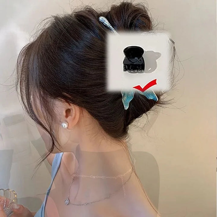 Sparkling women's mermaid tail hair clip with pearl accents. Elegant and unique hair accessory for fashion.