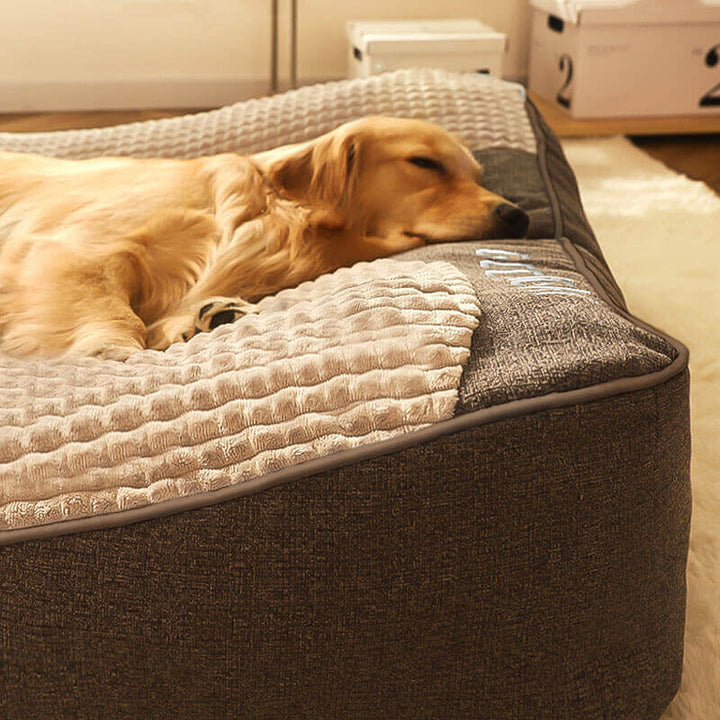 Plush large dog bed, gray, with orthopedic support and a durable, scratch-resistant cover for pet comfort.