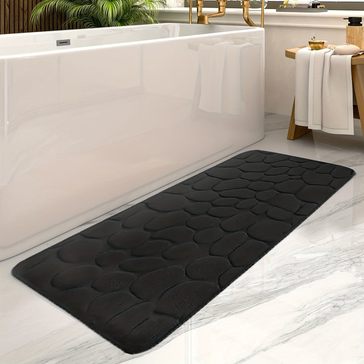 Rectangular polyester striped bath mat. Absorbent, non-slip for bathroom safety & comfort. Stylish home decor.