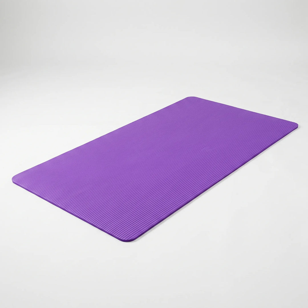 Vibrant purple, large, thick yoga mat for pilates & general fitness. Non-slip design for secure home workouts.