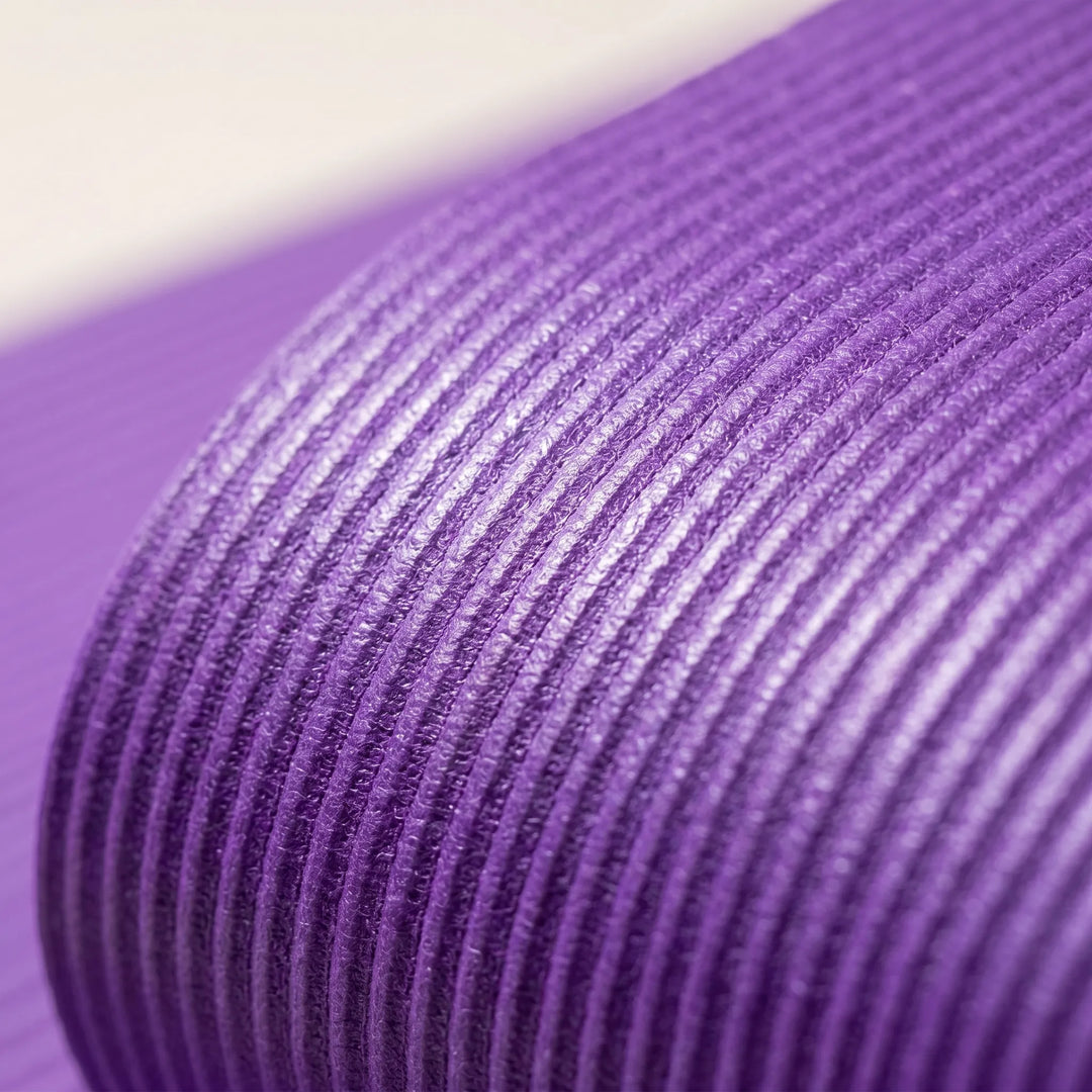 Thickened non-slip fitness mat for comfortable yoga, pilates, or general exercise routines. Large & durable.