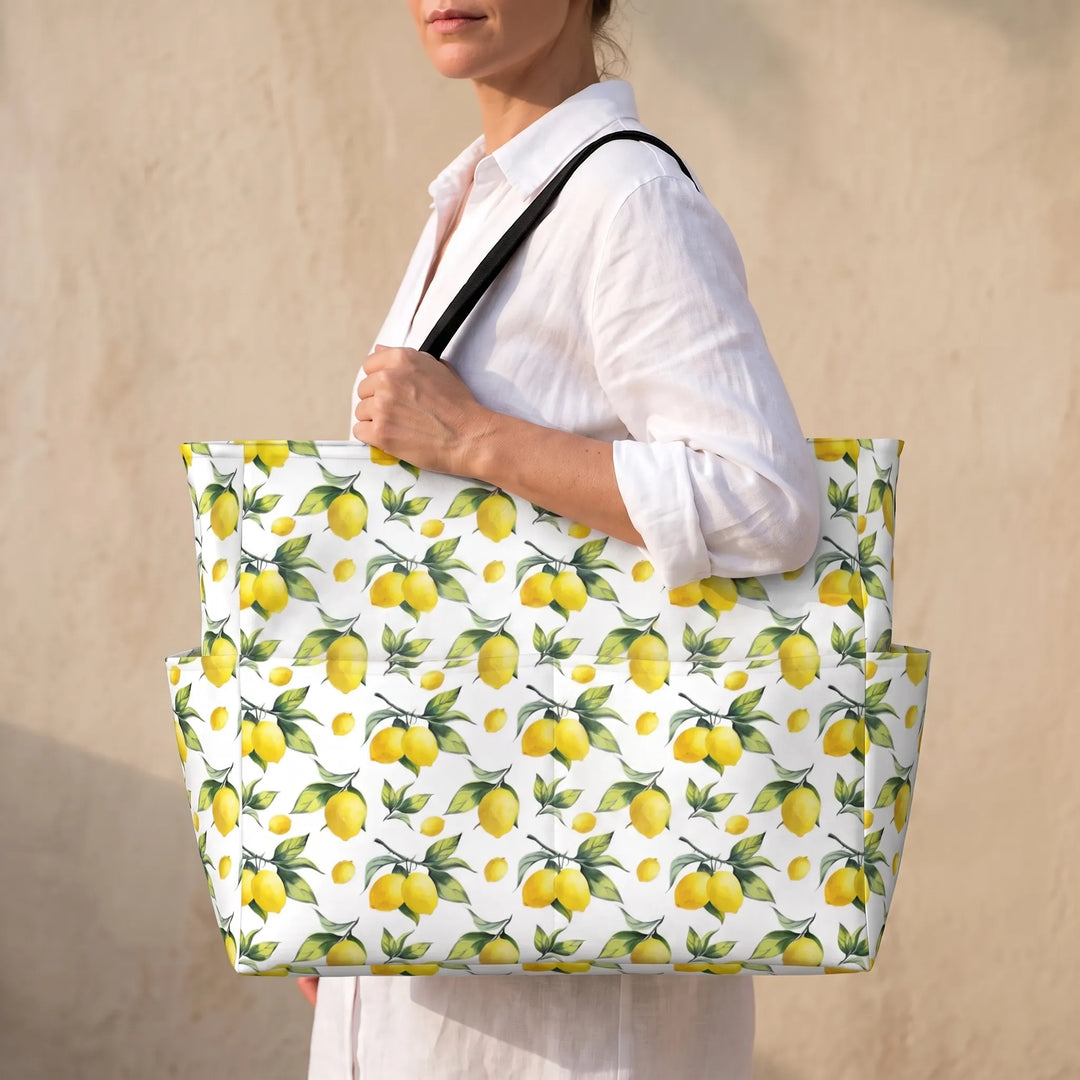 Large women's tropical lemon print beach tote bag, perfect for summer travel & shopping. Water-resistant carryall.