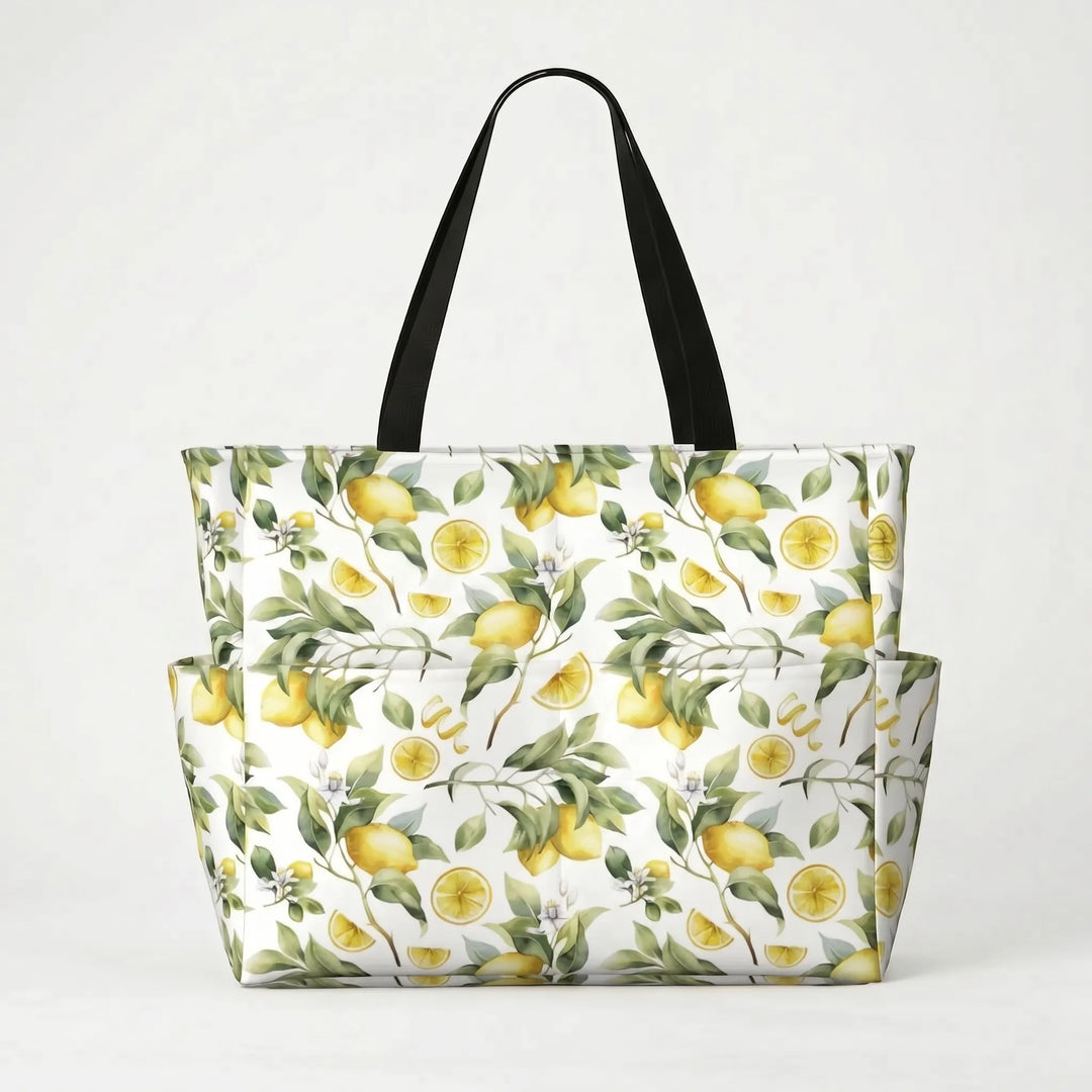 Durable strap detail on a large tropical lemon print beach tote bag, comfortable for shoulder carry during summer.