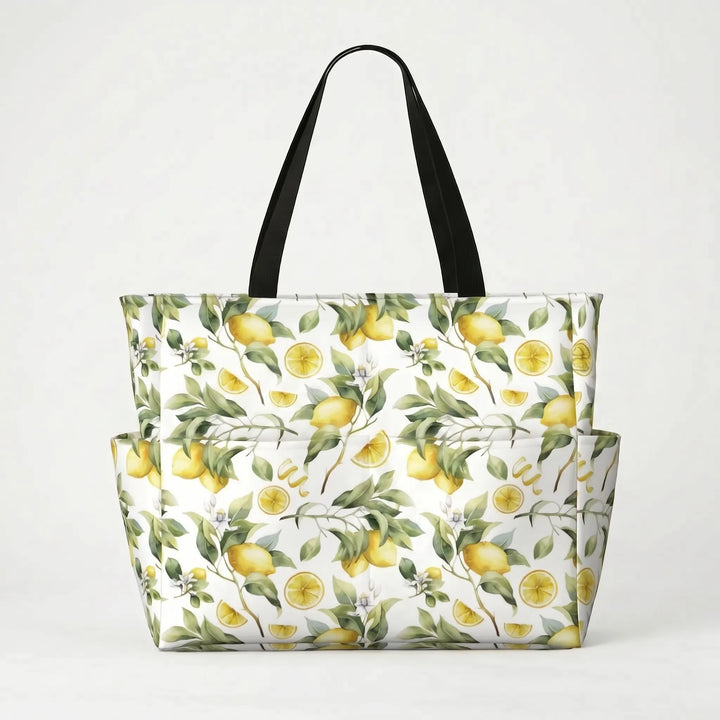 Durable strap detail on a large tropical lemon print beach tote bag, comfortable for shoulder carry during summer.
