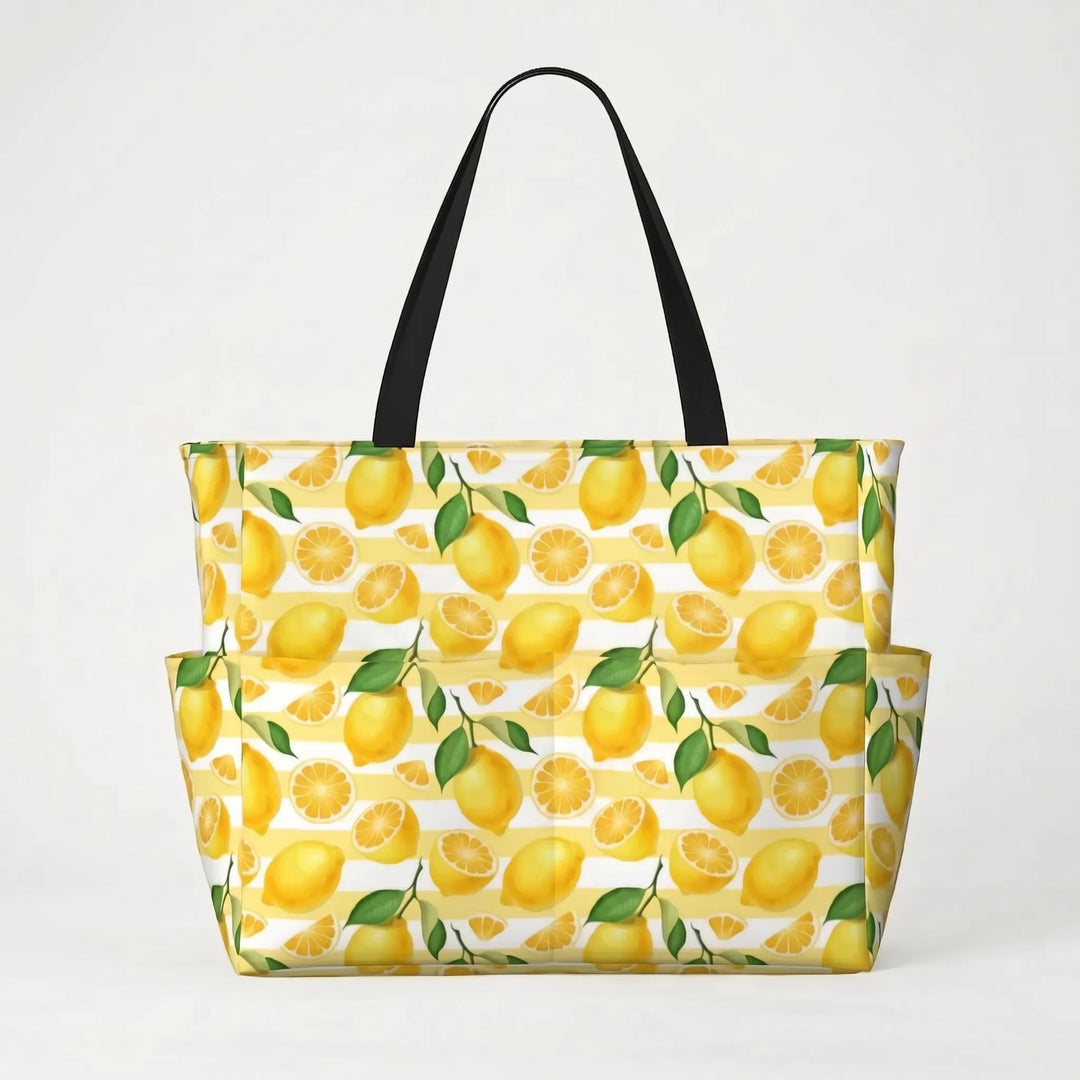 Water-resistant large tropical lemon print beach tote bag, keeping essentials dry for summer adventures.