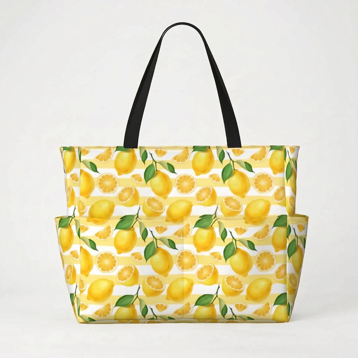 Water-resistant large tropical lemon print beach tote bag, keeping essentials dry for summer adventures.