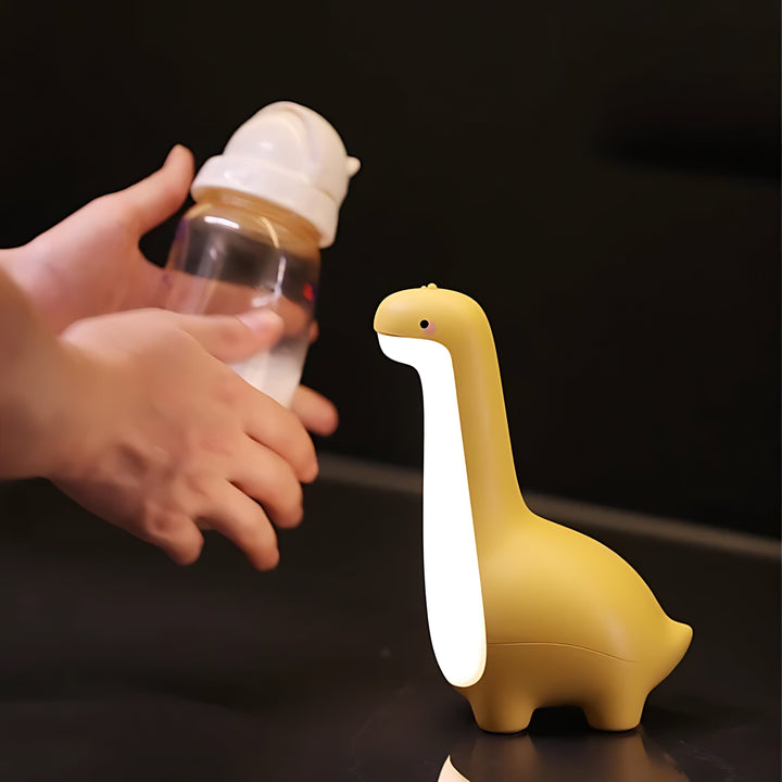 Cute LED dinosaur night light, provides a soft, soothing glow for kids' bedroom or nursery. Rechargeable.