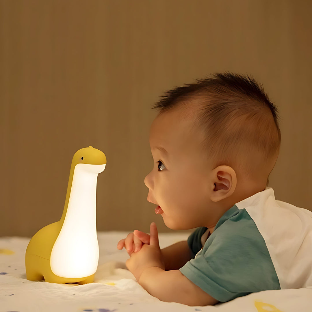 Portable & rechargeable LED dinosaur lamp, a child-safe night light for kids' soothing bedtime routine.