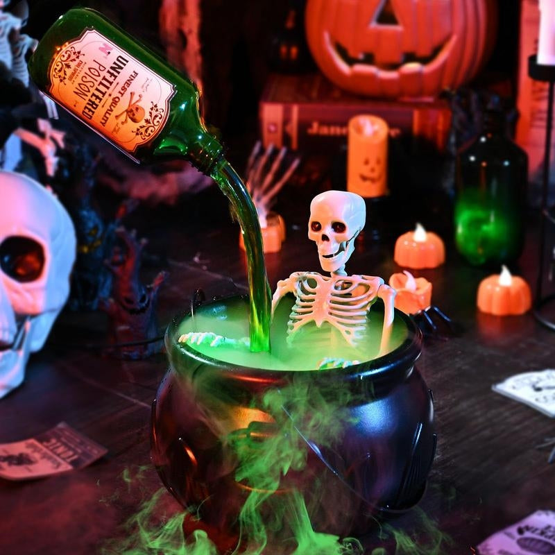Close-up of LED Light-Up Halloween Cauldron with mist, showing vibrant lights & spooky fog machine effect.