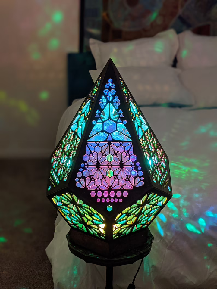Stained glass style LED lamp. Projects a starry night sky, serving as a decorative table lamp & ambient night light.