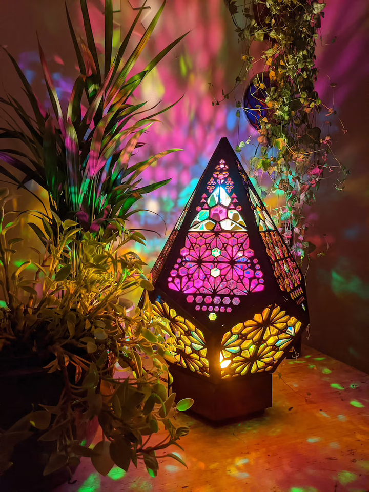 Decorative LED table lamp with unique stained glass style and enchanting starry sky projection. Ambient night light.