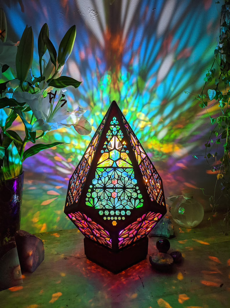 Star projector LED lamp. Stained glass design for ambient home lighting, creating a magical night light experience.