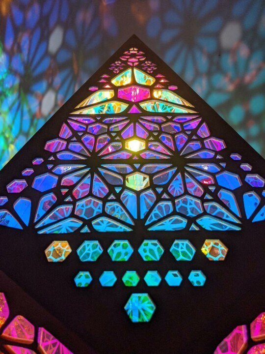 Unique LED star projector table lamp. Stained glass style, offers beautiful starry light for ambient home decor.