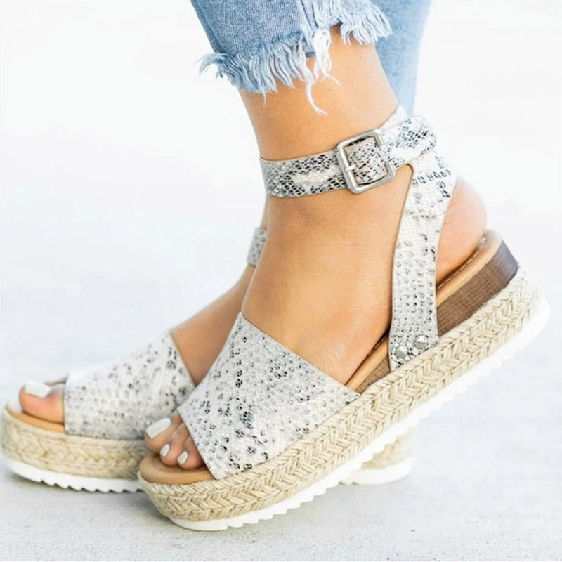 Women's fashionable Leona high heel sandals. Zipper closure, open toe, and comfortable block heel.