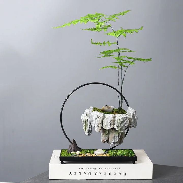 Levitating bonsai pot with a small green plant floating above a magnetic wooden base, ideal unique home decor.