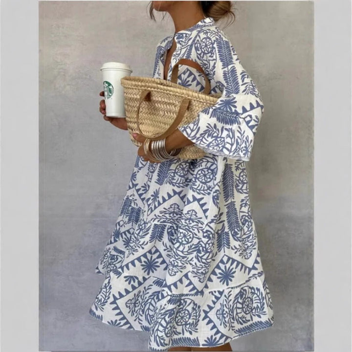 Light blue floral sundress for women with tiered skirt, boho tunic style, perfect for summer casual wear.