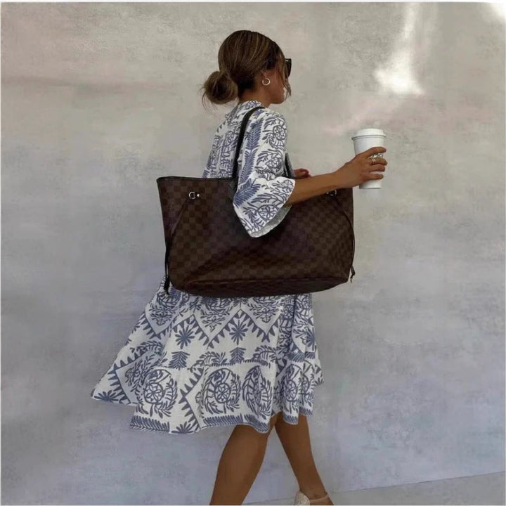 Effortless women's floral sundress featuring a tiered skirt & bohemian tunic style, ideal for spring outings.