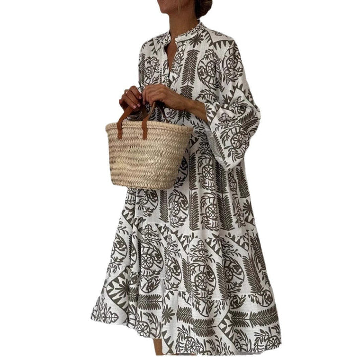 Vibrant floral print sundress for women, tiered boho tunic style. Great for warm weather, vacation, or casual wear.