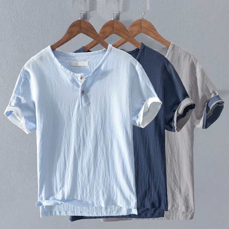 Men's relaxed fit short sleeve henley shirt, available in light blue, dark blue, & gray for summer casual wear.