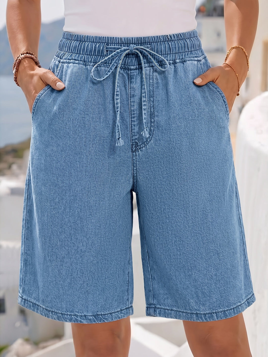 Women's wide-leg light blue bermuda shorts, perfect for comfortable and effortless casual summer fashion.