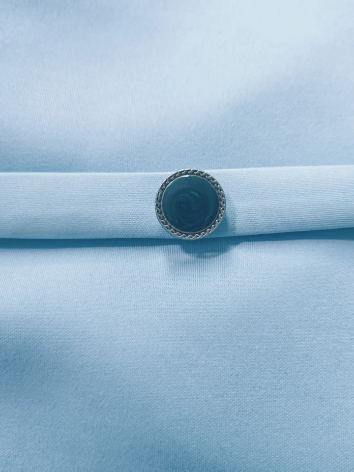 Elegant women's work dress: light blue belted midi, V-back, turn-down collar, and mid sleeves. Professional office wear.