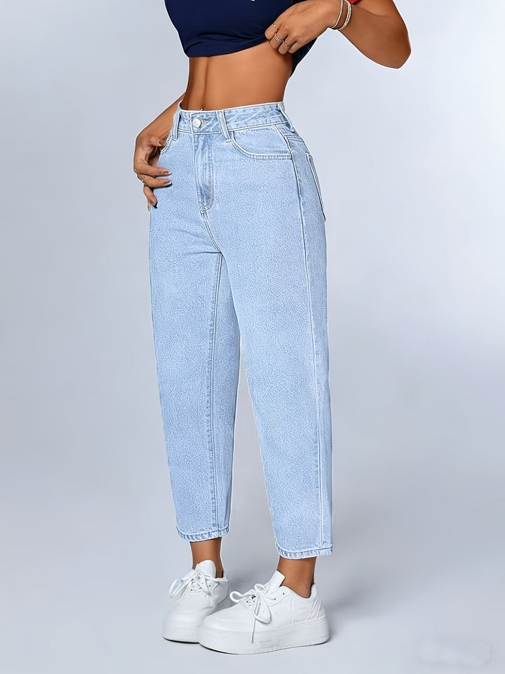 Women's light blue relaxed fit mom jeans. High waist, tapered leg, and cuffed hem for versatile comfort.