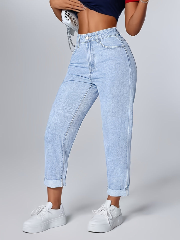 Casual light blue mom jeans for women. High waist, tapered fit, perfect for everyday retro fashion.
