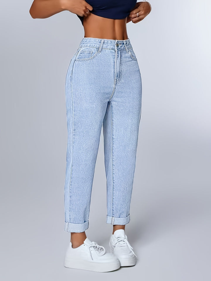 High waist light blue women's jeans. Relaxed mom fit, tapered leg, and comfortable for casual wear.
