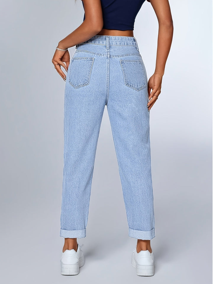 Retro-style light blue mom jeans. Women's high waist, tapered leg for a relaxed and versatile look.
