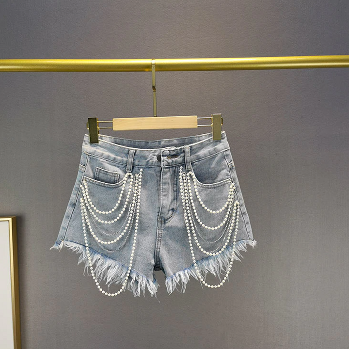 Fashionable women's light blue shorts with unique pearl & tassel trim. A must-have for summer chic attire.