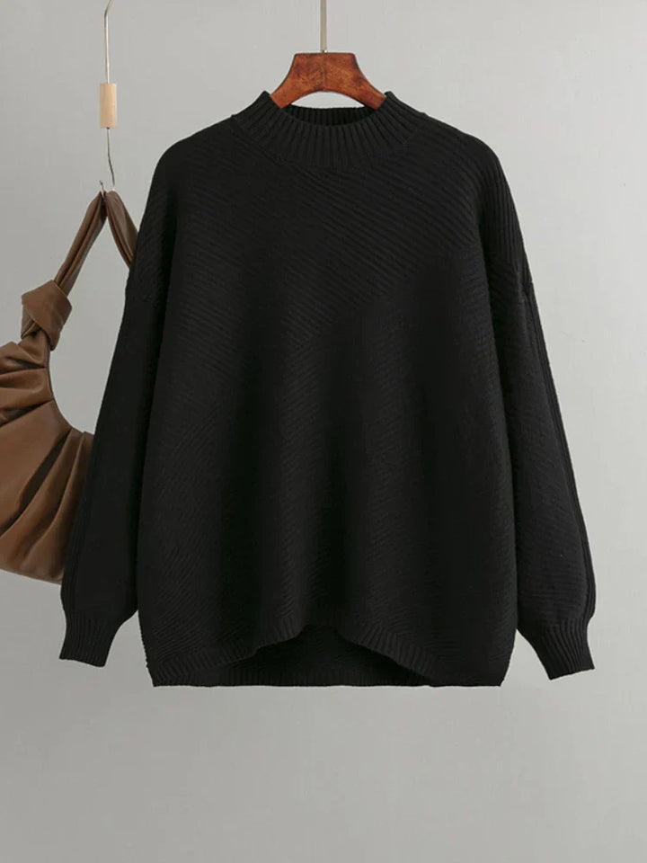 Black oversized knit women's sweater. Classic ribbed design, round neck, comfortable casual top.