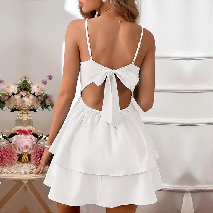 Light blue women's vacation ruffle mini dress, spaghetti strap A-line design.