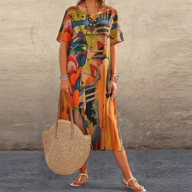 Women's loose fit midi summer dress, light fabric, short sleeves. An elegant & comfortable choice for daily wear.