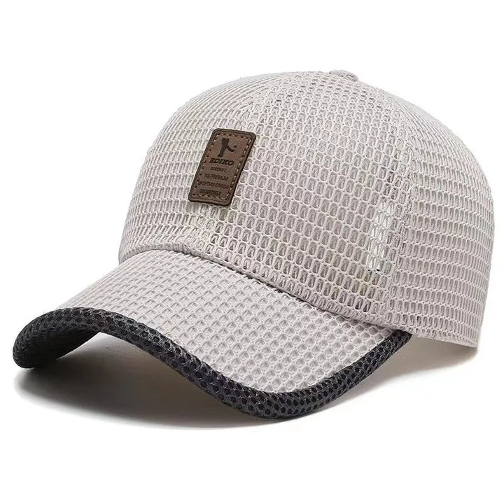 Woman wearing a breathable AeroBreeze mesh summer cap, ideal for lightweight sun protection during outdoor adventures.