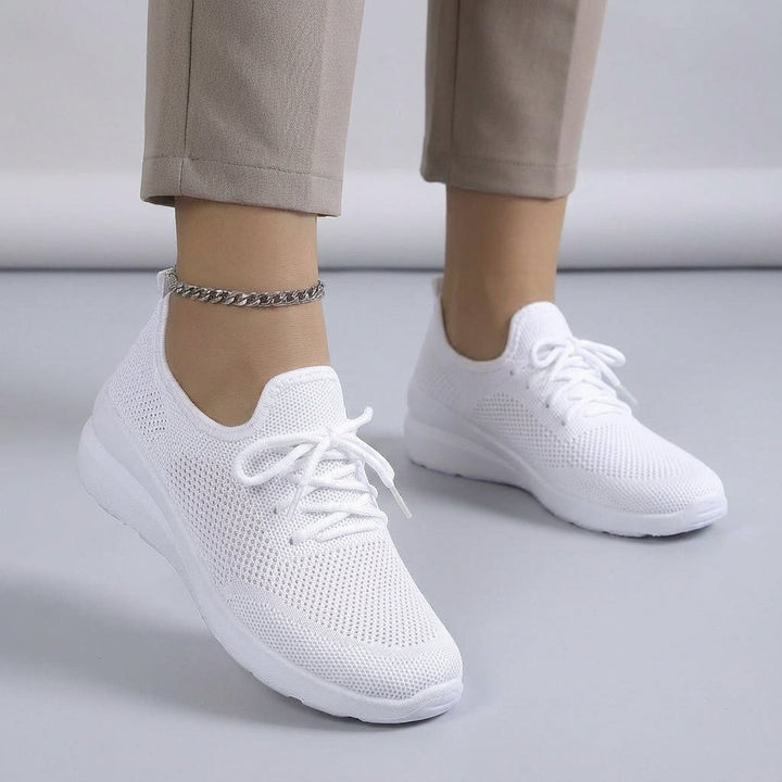 Stylish women's breathable sneaker in a light tone, offering comfort for daily activities.
