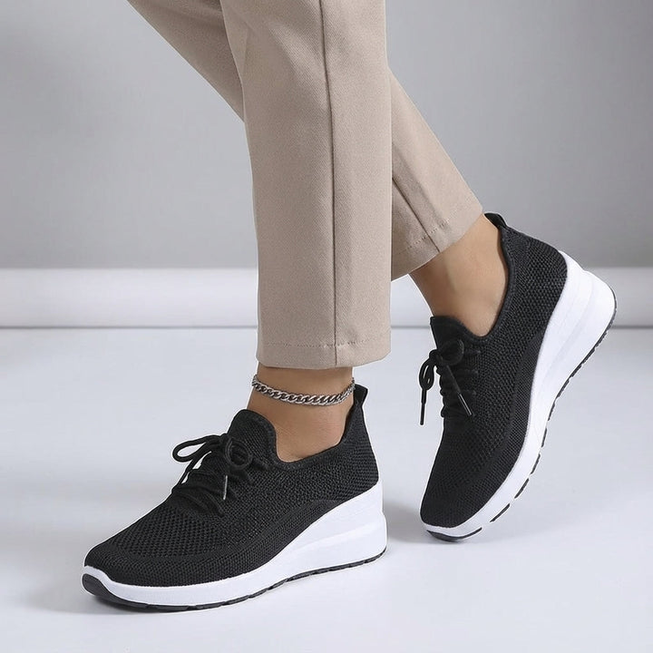 Pair of women's lightweight and breathable casual sneakers, perfect for all-day wear and walking.