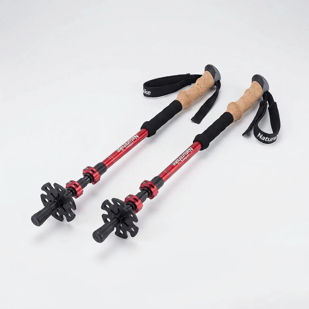 Adjustable carbon fiber hiking poles offering stable all-terrain support for hikers & outdoor enthusiasts.
