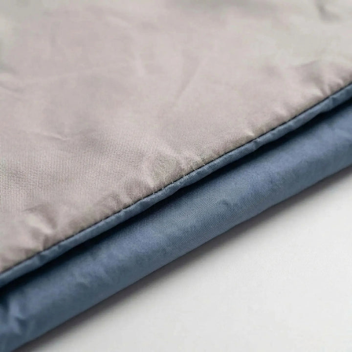 Compact & portable brown sleeping bag, designed for warm weather camping and hiking trips.